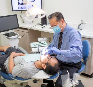 Dr. Wu with a patient at the Irvine dental office