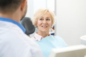 senior woman smiling during dental consultation