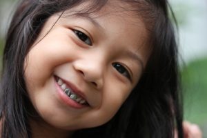 child with dental crowns