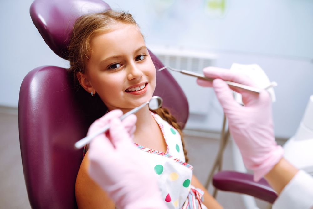 girl attends regular dental checkup