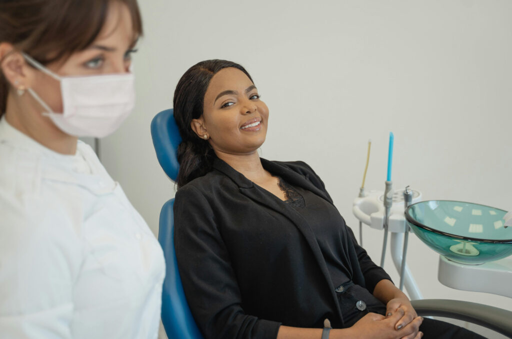 Smiling woman at dentist appointment.